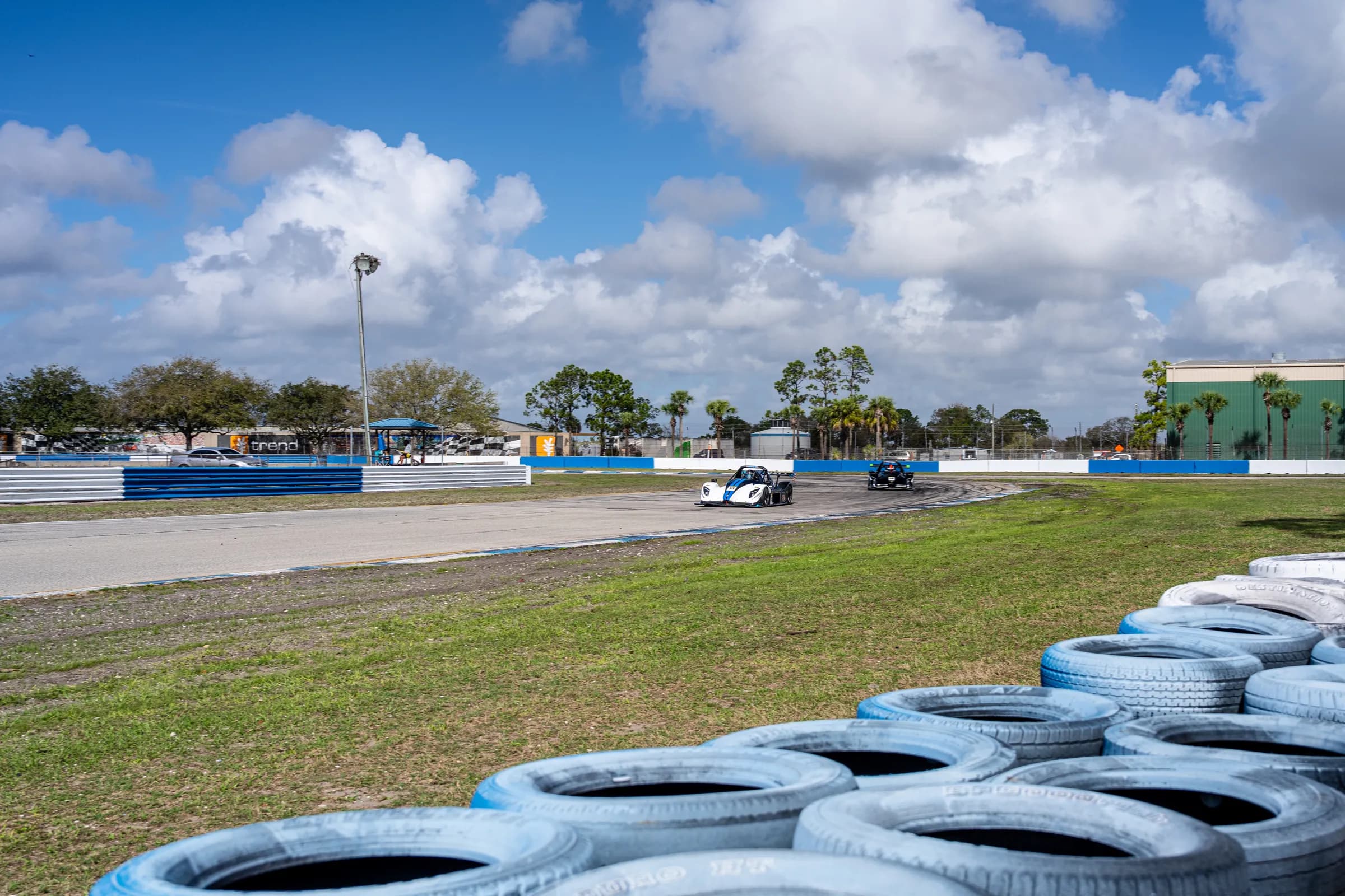 Radical race cars in wheel-to-wheel action during advanced school